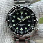 Front view of the STEELDIVE SD1975K black dial with date window inside the steel shroud