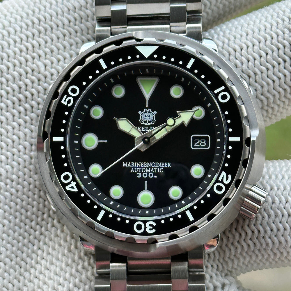 Front view of the STEELDIVE SD1975K black dial with date window inside the steel shroud