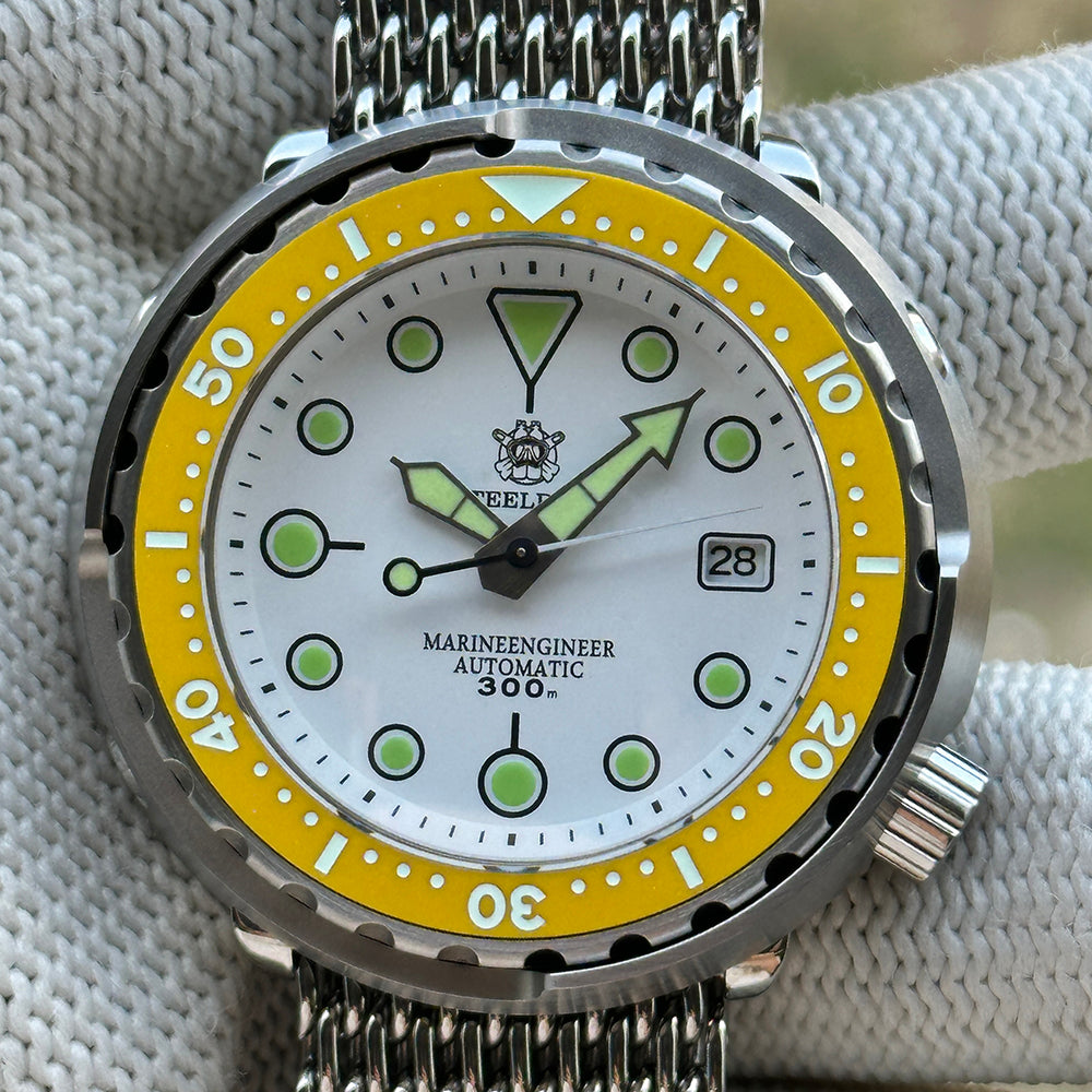 Front view of the STEELDIVE SD1975N white dial with yellow bezel on a steel mesh bracelet