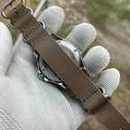 Khaki nylon strap of the STEELDIVE SD1957L seen from the caseback side