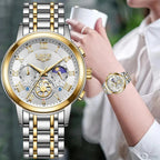 LIGE Luxury women's chronograph watch with white dial and two-tone steel bracelet worn by a woman holding a cup