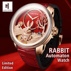 Lucky Harvey ZLS201-1 rabbit automaton watch shown at an angle in a red themed lifestyle scene