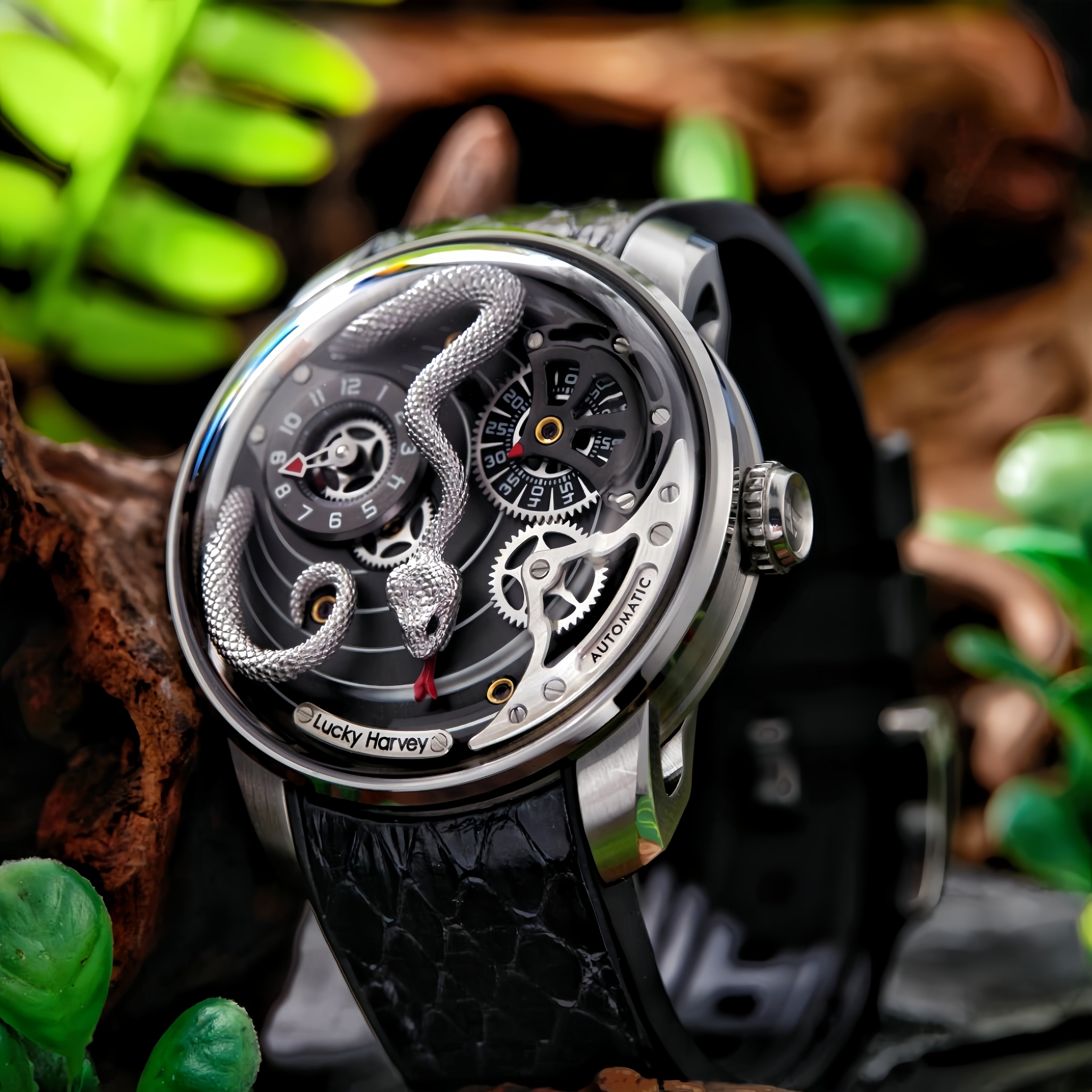 Lucky Harvey ZLS203-2 silver snake automatic watch lifestyle on wood with ferns and jade