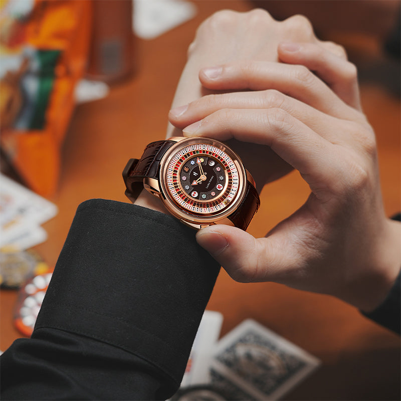 Lucky Harvey ZLS302-2 rose gold poker roulette automatic watch worn on a wrist holding playing cards
