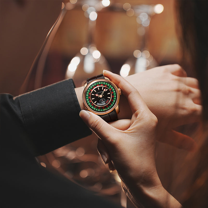 Lucky Harvey ZLS303-1 European Roulette watch held in hand in bar setting with wine glass bokeh
