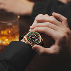 Lucky Harvey ZLS303-1 European Roulette watch held in hand beside whiskey glass in lifestyle scene