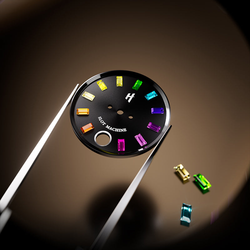 Lucky Harvey ZLS305-2 watch black dial held by tweezers with loose colored gemstone markers