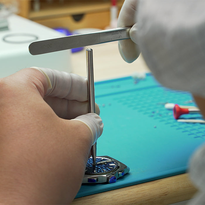 Lucky Harvey ZLS402-1 watch case being machined in the workshop by a gloved technician