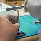 Lucky Harvey ZLS402-1 watch case being machined in the workshop by a gloved technician