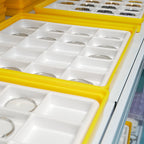 Lucky Harvey ZLS402-1 case components stored in yellow and white production trays
