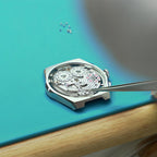 Lucky Harvey ZLS402-2 chiming movement seated in case on workbench with tweezers
