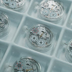 Lucky Harvey ZLS402-2 chiming movements arranged in production trays close-up