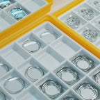 Lucky Harvey ZLS402-2 production lifestyle with sapphire crystals and movement trays in workshop