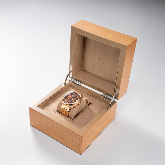 Lucky Harvey ZLS402-3 rose gold watch displayed in open wooden box