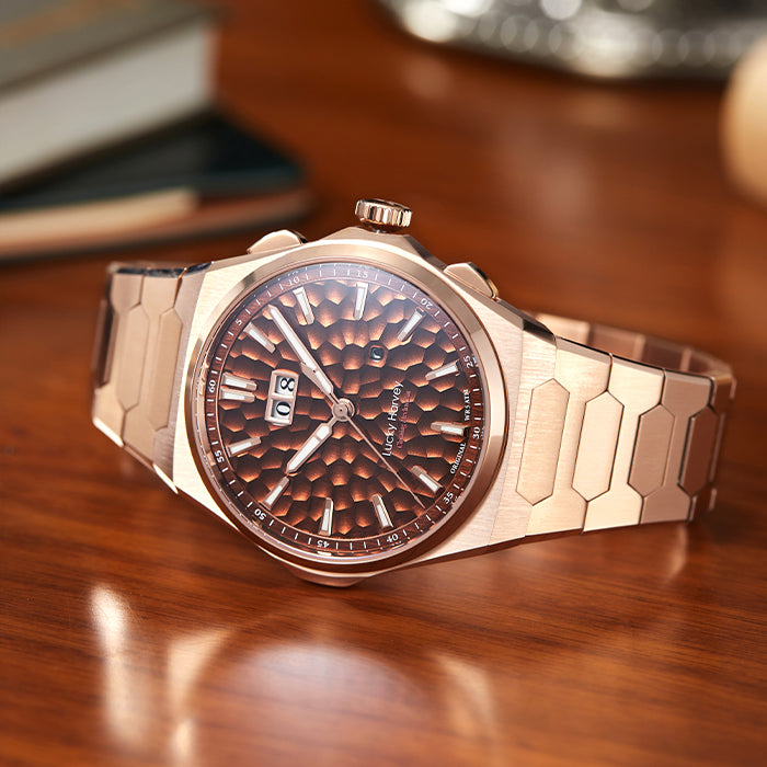 Lucky Harvey ZLS402-3 rose gold watch on wooden desk with books lifestyle scene