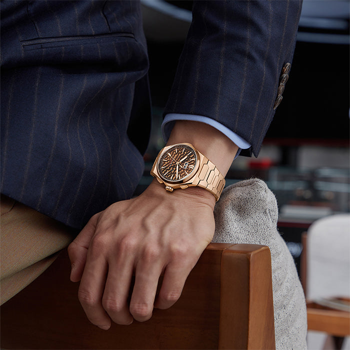 Lucky Harvey ZLS402-3 rose gold chiming watch worn on wrist with pinstripe suit
