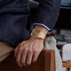 Lucky Harvey ZLS402-3 rose gold chiming watch worn on wrist with pinstripe suit