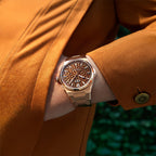 Lucky Harvey ZLS402-3 rose gold chiming watch worn on wrist with tan suede coat