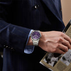 Lucky Harvey ZLS402-4 purple hammer chiming watch worn on wrist with navy suit