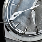 Lucky Harvey ZLS413-1 titanium watch macro detail of polished hands and indices on meteorite dial