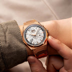 Lucky Harvey ZLS413-2 rose gold meteorite chiming watch on wrist with bracelet and tan sleeve