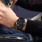 MEGIR 1067 men's watch on the wrist, black case with an industrial-style rose-gold-accented dial and black strap