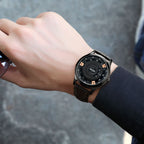MEGIR 1067 men's watch on the wrist, black case and industrial-style dial with rose-gold accents on a black strap