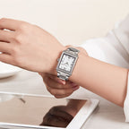 MEGIR 1079 women's watch on the wrist, silver-tone rectangular case and bracelet with a white numeral dial