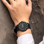 MEGIR 1081 men's watch on the wrist, black fluted dial with day-date window, all-black case and strap