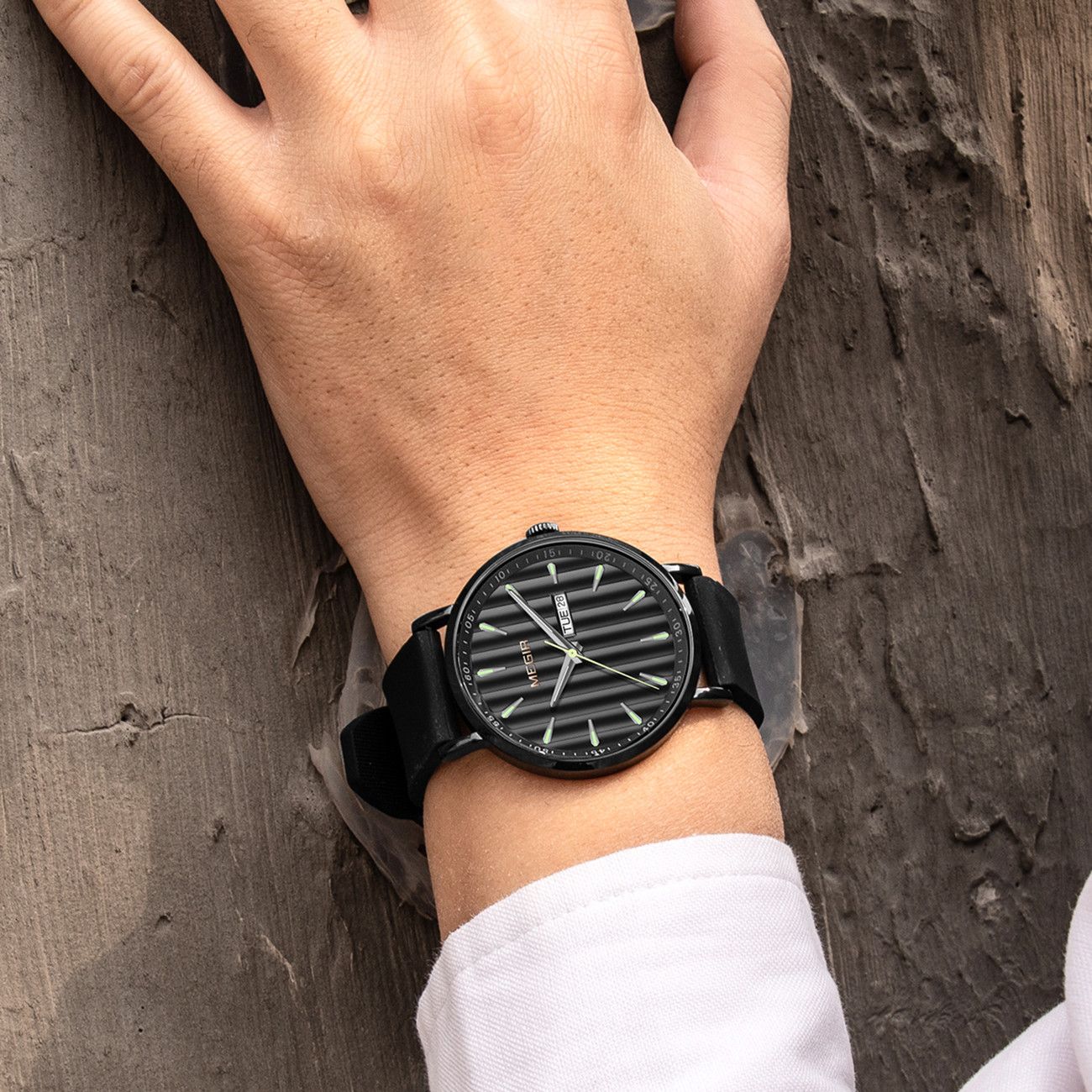 MEGIR 1081 men's watch on the wrist, black fluted dial with day-date window, all-black case and strap