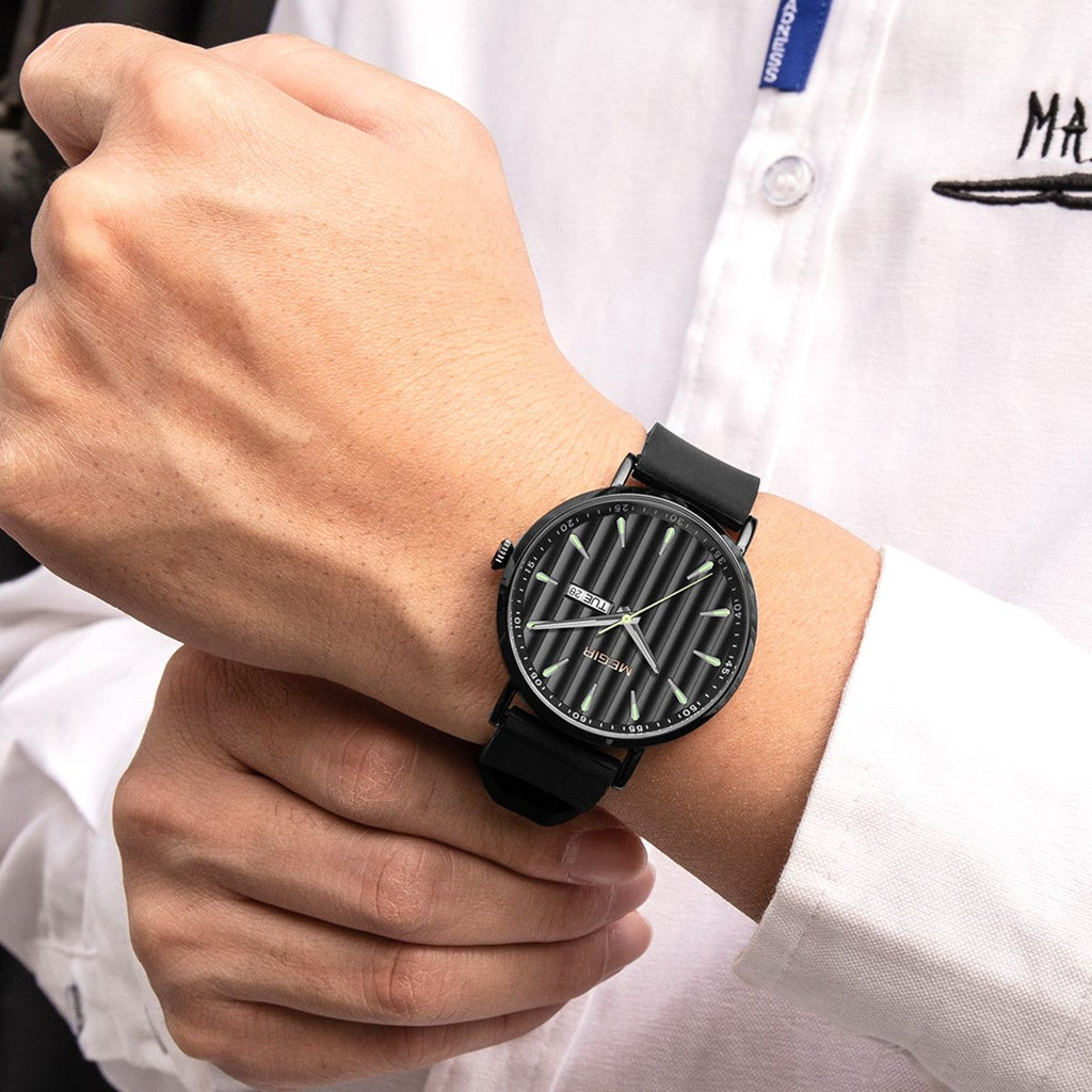 MEGIR 1081 men's watch on the wrist, black fluted dial and black case on a black silicone strap