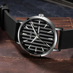 MEGIR 1081 men's watch, black fluted dial, silver-tone case and black strap on a leather surface