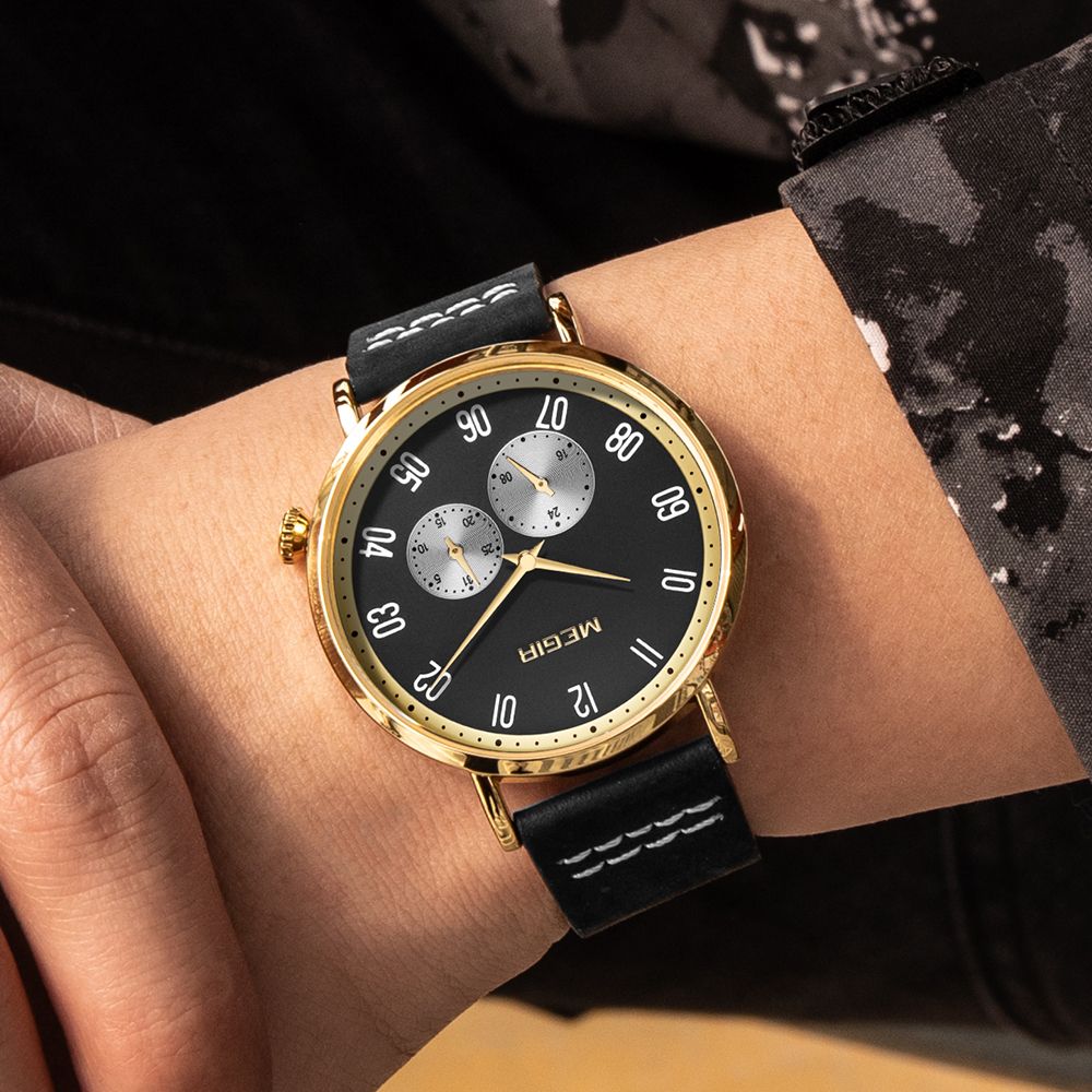 MEGIR 1083 men's multifunction watch on the wrist, black dial, gold-tone case and black leather strap