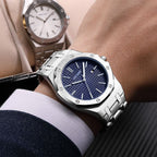 MEGIR 1085 men's watch on the wrist, blue textured dial and octagonal bezel on a silver-tone bracelet