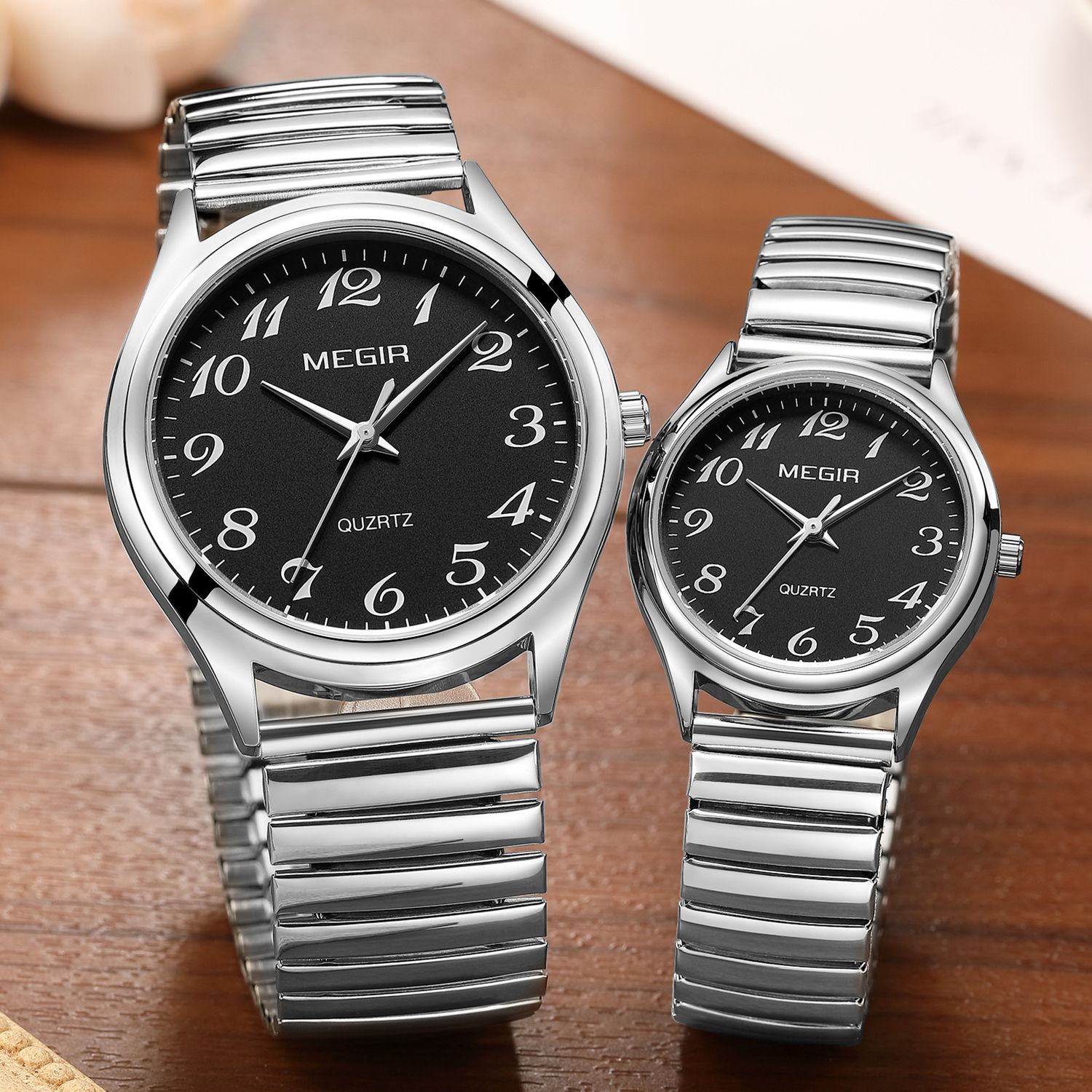 MEGIR 1088 unisex watch pair in silver-tone with black Arabic-numeral dials and stretch bracelets