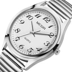 MEGIR 1088 unisex watch, silver-tone case with luminous green Arabic-numeral dial and stretch bracelet, angled view