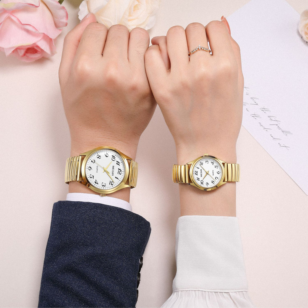MEGIR 1088 unisex watch pair on the wrist in gold-tone with white Arabic-numeral dials and stretch bracelets