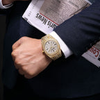MEGIR 1091 men's iced-out watch on the wrist, gold-tone octagonal case fully set with crystals