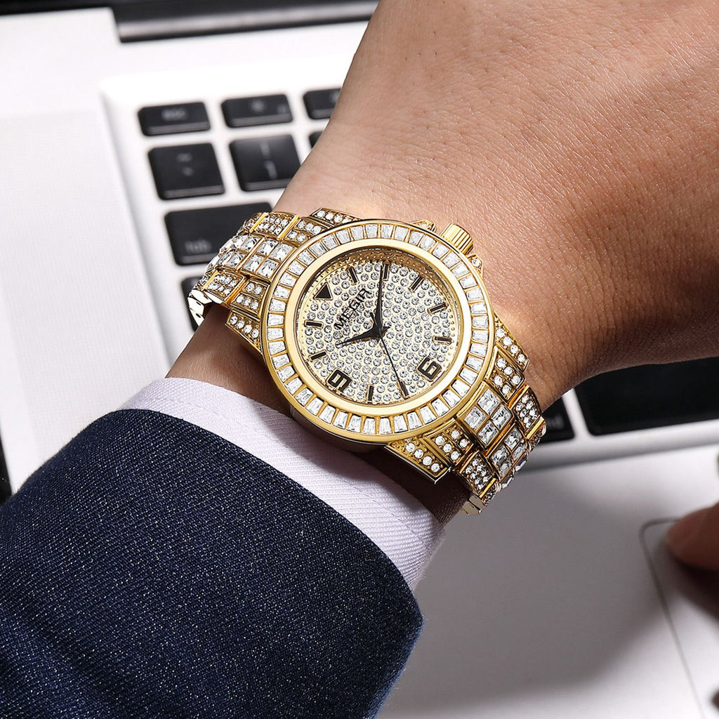 MEGIR 1092 men's iced-out watch on the wrist, gold-tone case and bracelet with crystal-paved dial