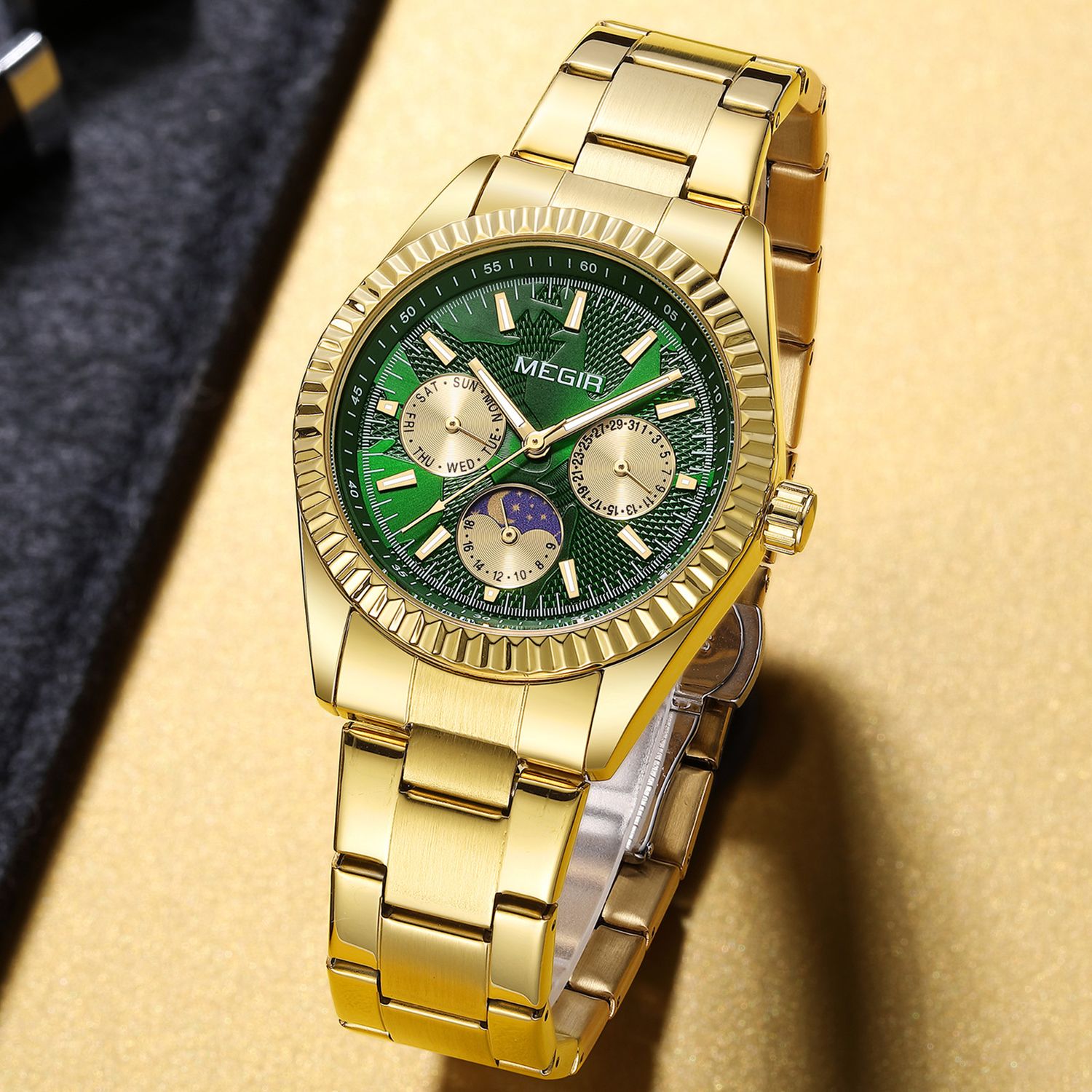 MEGIR 1102 men's multifunction watch, gold case with green moon-phase dial and gold steel bracelet, angled view