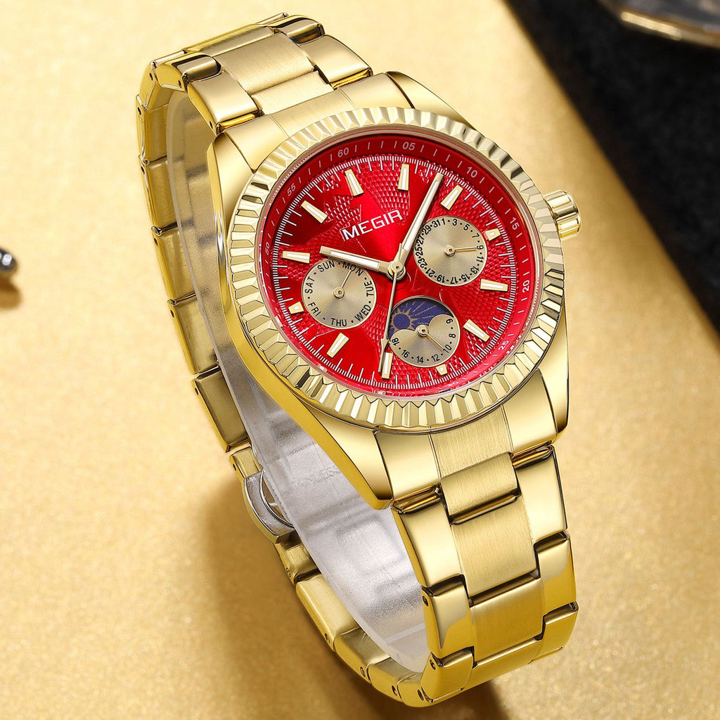 MEGIR 1102 men's multifunction watch, gold case with red moon-phase dial and gold steel bracelet, angled view