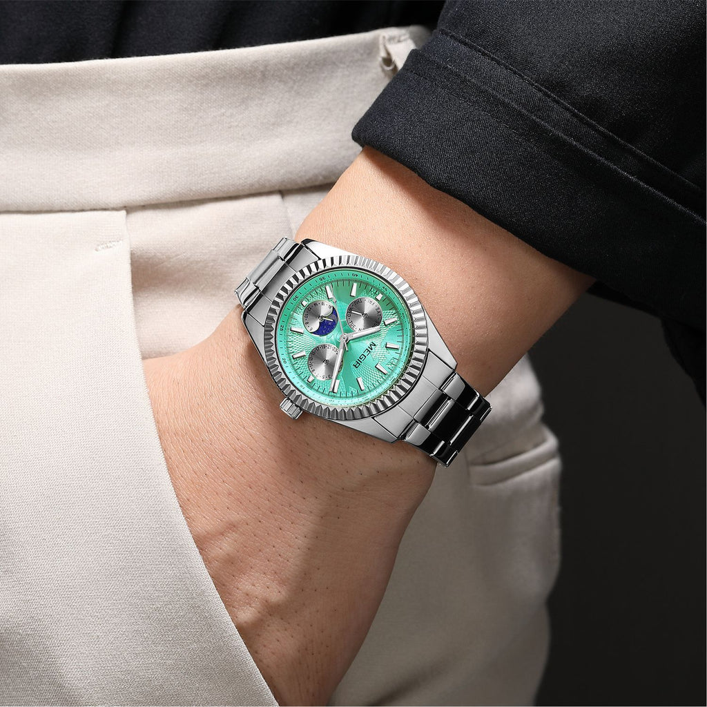 MEGIR 1102 men's multifunction watch on the wrist, silver case with turquoise moon-phase dial and steel bracelet