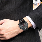 MEGIR 2011 men's chronograph watch on the wrist, black case with black dial and black mesh bracelet