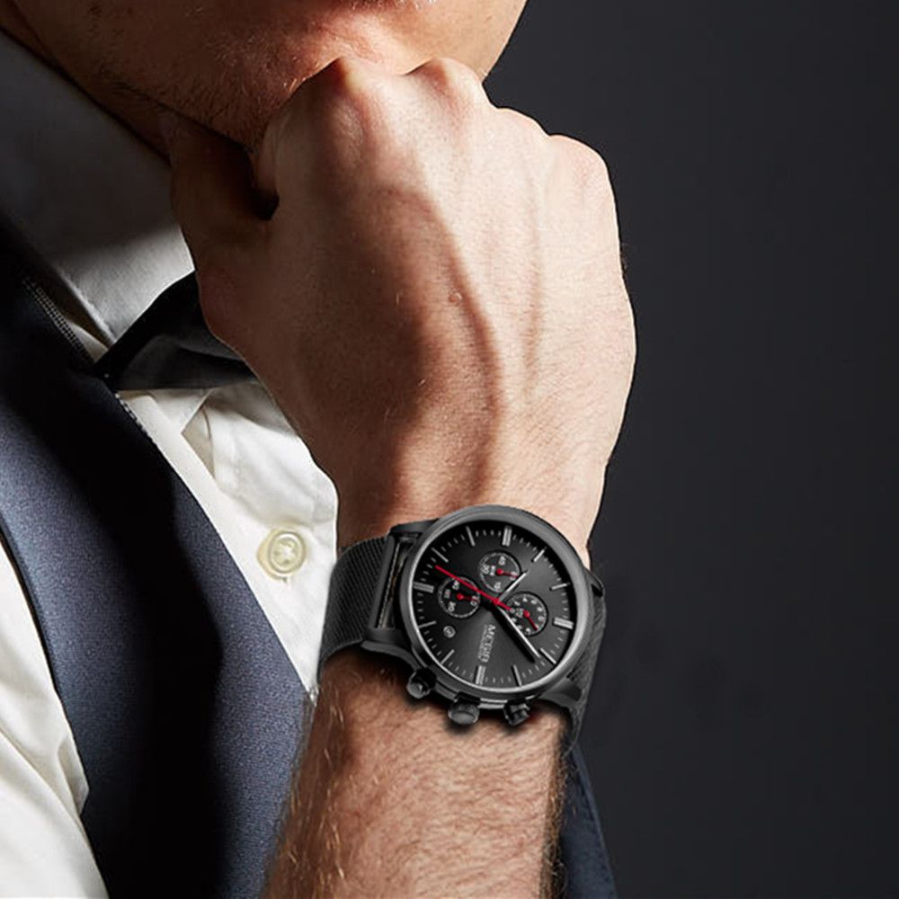 MEGIR 2011 men's chronograph watch on the wrist, black case with black dial and black mesh bracelet, close-up