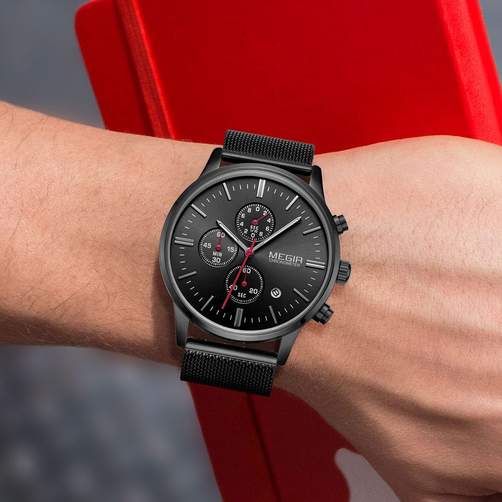 MEGIR 2011 men's chronograph watch on the wrist, black case with black dial, red accents and black mesh bracelet