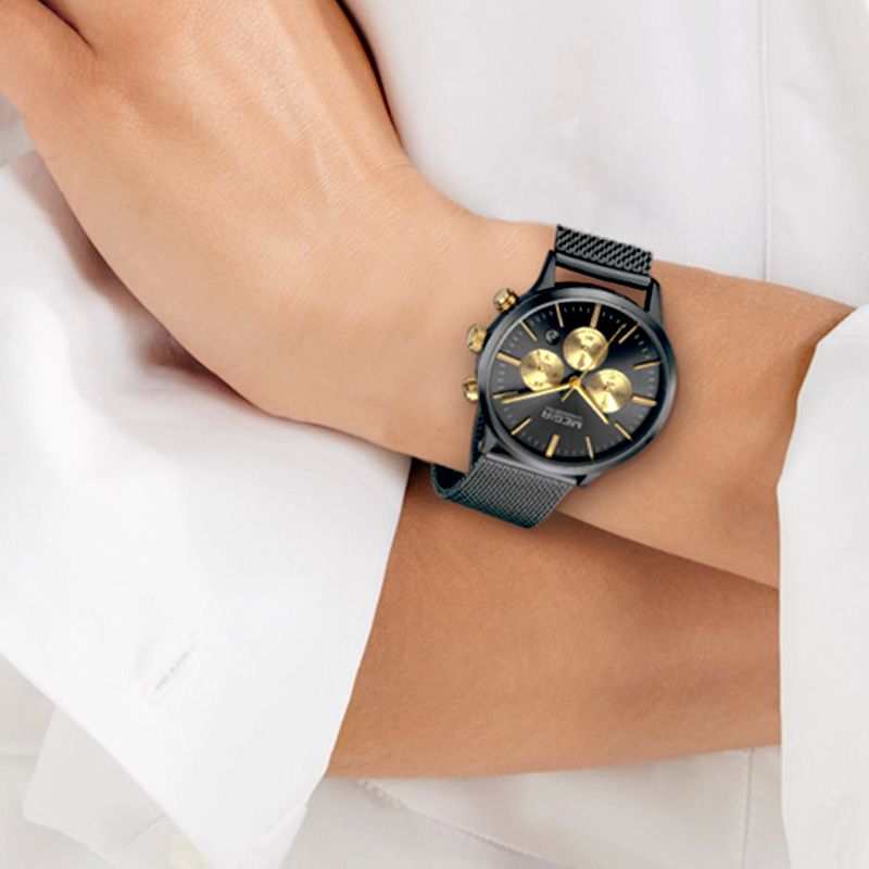 MEGIR 2011 women's chronograph watch on the wrist, black case with black dial, gold sub-dials and black mesh bracelet