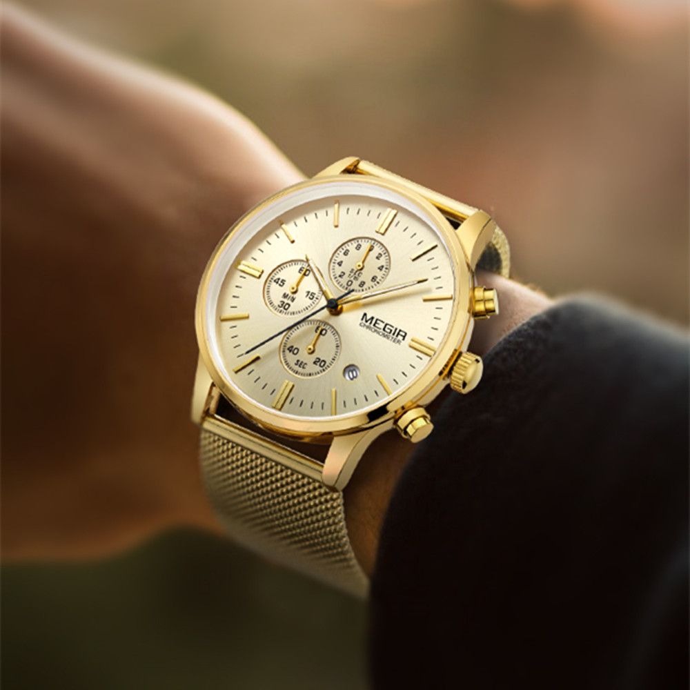 MEGIR 2011 men's chronograph watch on the wrist, gold case with gold dial and mesh bracelet, close-up