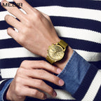 MEGIR 2011 men's chronograph watch on the wrist, gold case with gold dial and mesh bracelet