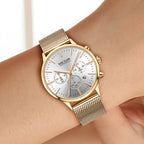 MEGIR 2011 women's chronograph watch, rose-gold case with white dial and mesh bracelet, worn close-up