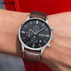 MEGIR 2011 men's chronograph watch on the wrist, silver case with black dial and brown leather strap